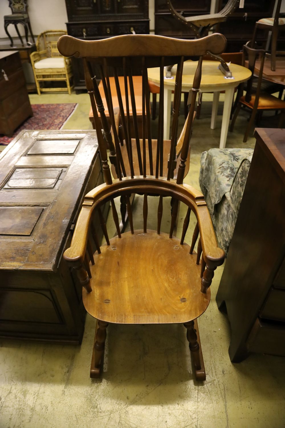 Two beech wood spindle back rocking armchairs, width 56cm, depth 55cm, height 128cm